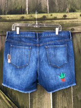 Load image into Gallery viewer, Sz 14 denim cut off shorts with custom embroidery and patches