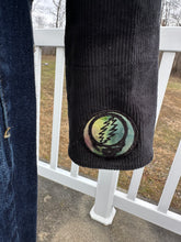 Load image into Gallery viewer, Women’s size M black corduroy button up jacket with custom tie dye appliqués.
