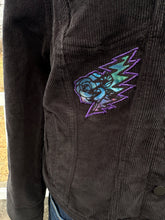 Load image into Gallery viewer, Women’s size M black corduroy button up jacket with custom tie dye appliqués.
