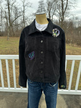 Load image into Gallery viewer, Women’s size M black corduroy button up jacket with custom tie dye appliqués.
