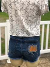 Load image into Gallery viewer, Sz 9 cut off Billy Strings shorts
